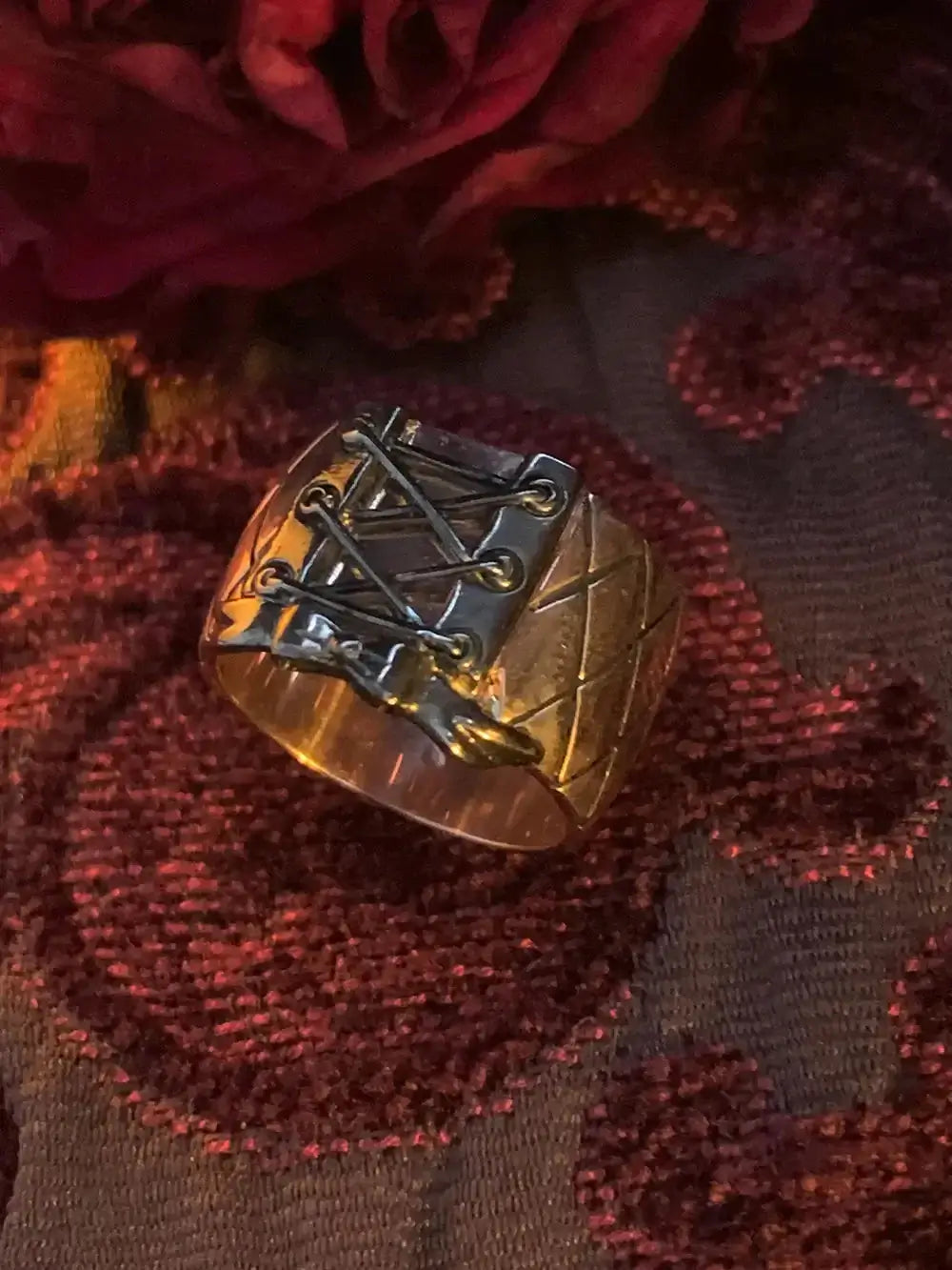 A WHITE GOLD corset ring that adds style to your finger