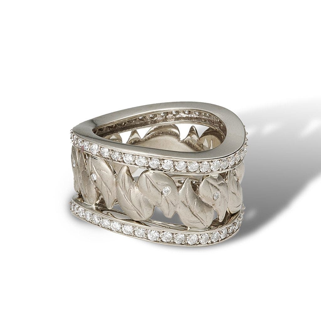 An eternity band of a unique wavy pathway of paisley leaves and diamonds