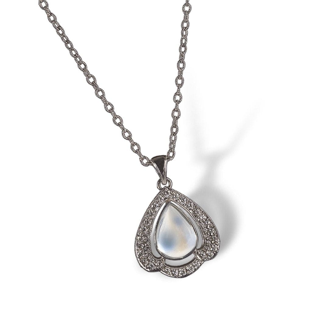 A moonstone pendant framed in petal of diamonds