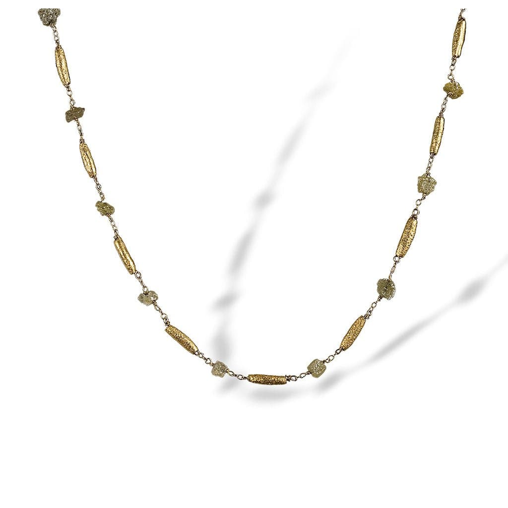 Textured necklace of enriched 18K yellow fine gold rounded tubular pieces with rough diamonds 