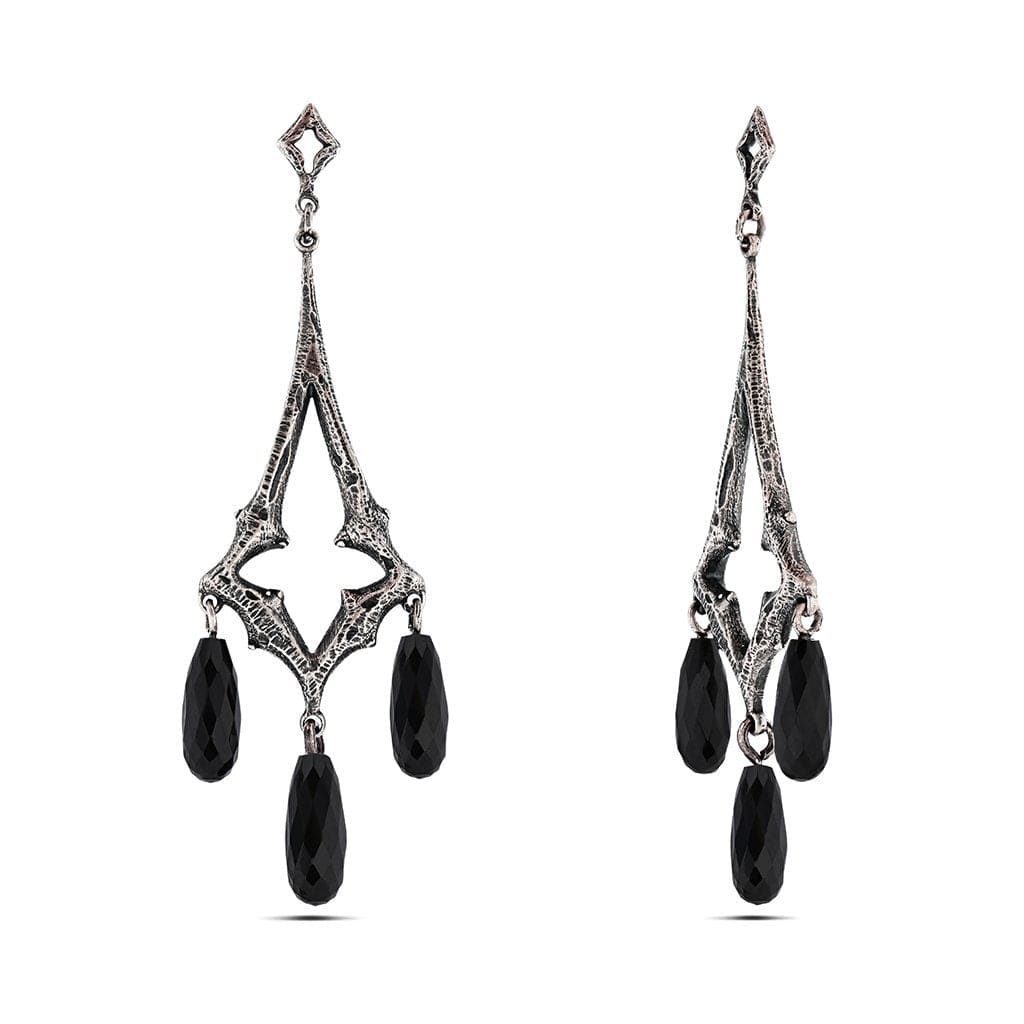 An elongated diamond shaped floral cut out chandelier earring with black onyx briolettes