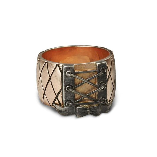 A WHITE GOLD corset ring that adds style to your finger