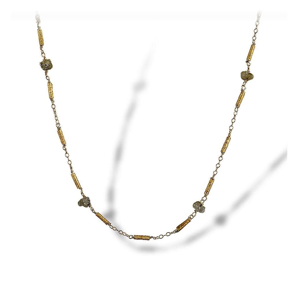Textured necklace of enriched 18K yellow fine gold petite tubular pieces with rough diamonds