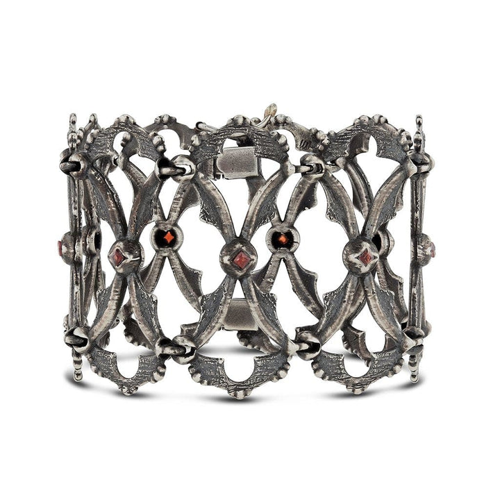 A linked bracelet cuff with texture and detailed in intricate gothic vintage design