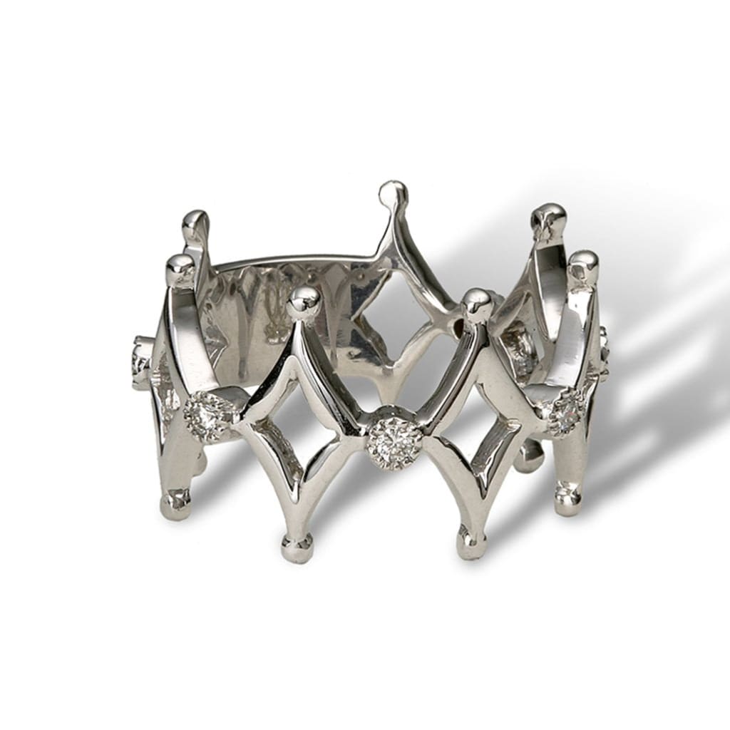 An eternity band of alternating design of diamond shape motifs and white diamond florals