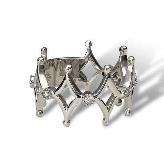 An eternity band of alternating design of diamond shape motifs and white diamond florals