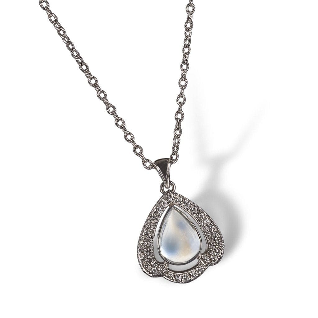 A moonstone pendant framed in petal of diamonds 